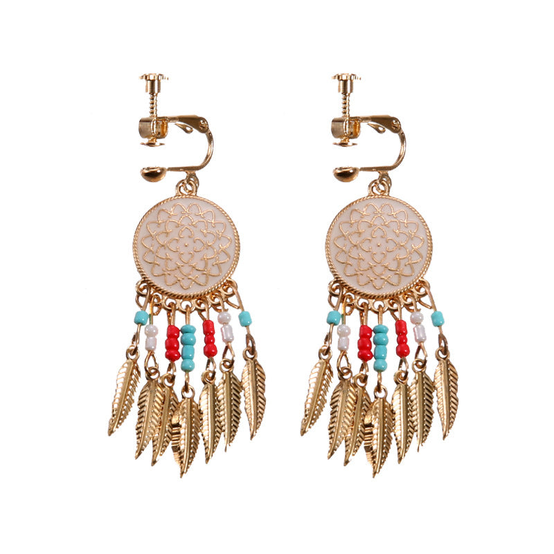 Boho vintage clip-on drop earrings with fringe and bead accents, zinc alloy build, studio image on white background