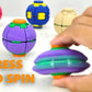 Several coloured fidget balls with a hand pressing a purple one to spin its gear ring