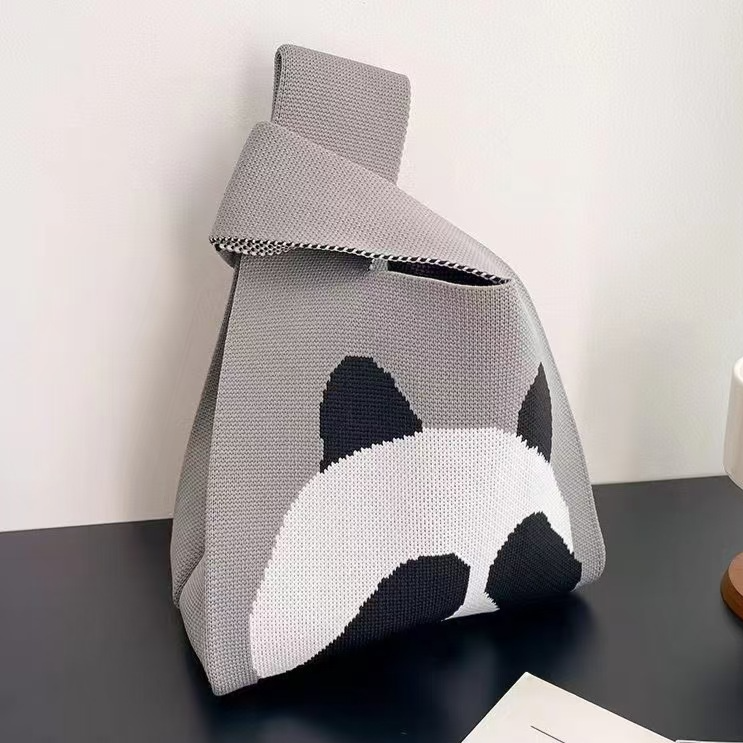 Polyester knit handbag with a jacquard design worked into the fabric
