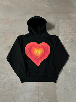Black pullover hoodie with a hand painted Home Sick heart printed across the chest