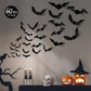 Several black 3D bat stickers of different sizes scattered on a light wall