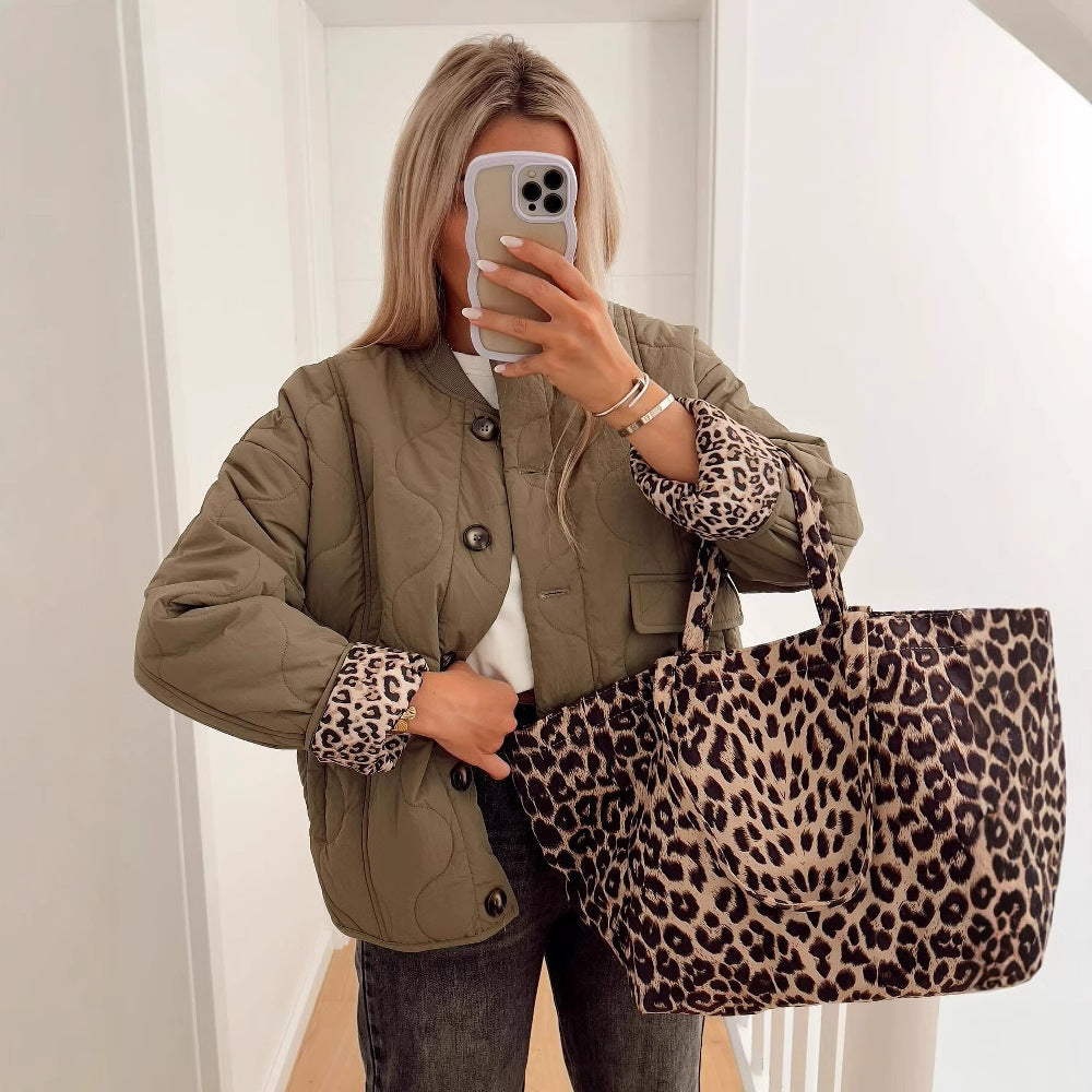 Close view of the ribbed stand collar with the leopard print lining on its inner face