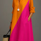 Orange and Pink Color Block polyester shirt collar long sleeve A-line midi dress on a standing model