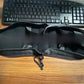 Black zippered travel pillow opened to show its inner channels, with a small clip on the zip pull, Pillow New option