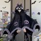 Hooded animal cape blanket worn as a cape with plush paw cuffs on the hands