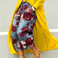 Wide leg cropped denim jeans with burgundy and pink rose print on light blue denim, yellow coat
