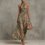 Green slimming dress front view showing the seamed defined waist and soft draping skirt