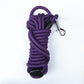Purple round nylon dog training long line coiled with a metal snap clip and loop handle