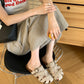 Flat lay overview of the woven fisherman slide sandals pair