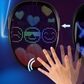 LED costume mask display with colorful hearts and ringed eyes while a hand waves beside the mask