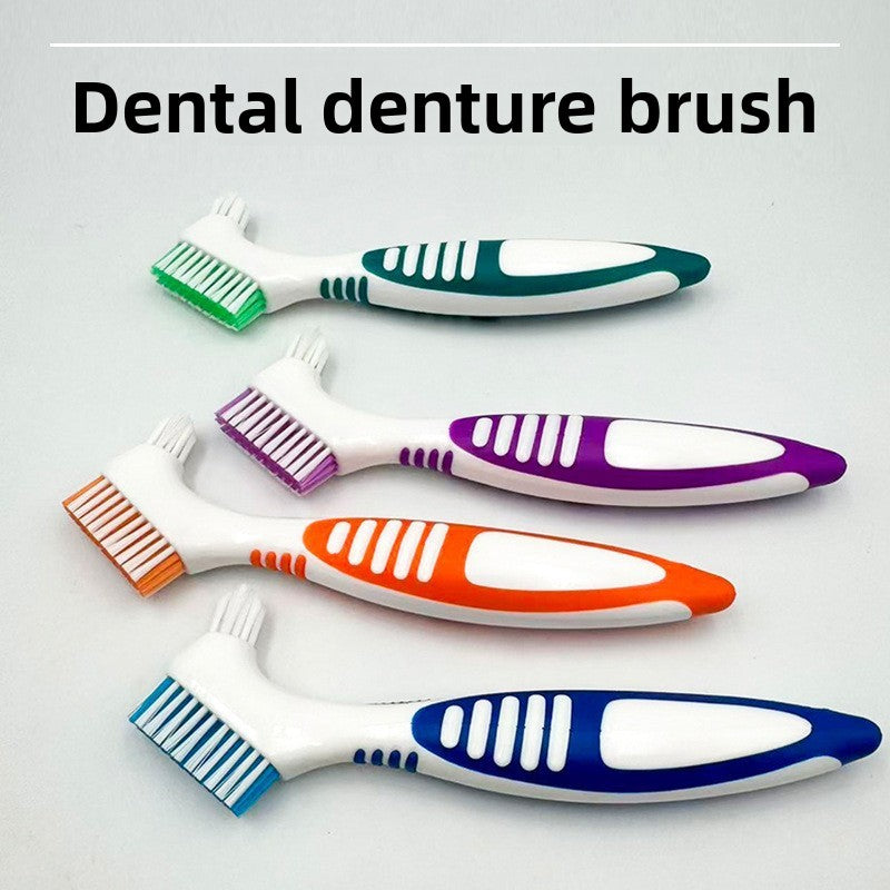 Four double headed denture brushes fanned out showing the wide flat head and small tapered head in four colors