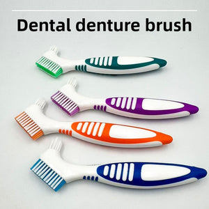 Four double headed denture brushes fanned out showing the wide flat head and small tapered head in four colors