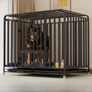 Black flat top iron dog crate with slide out tray and wheels holding a large rottweiler indoors