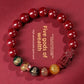 Cinnabar Five-Way Wealth God beaded bracelet shown on plain background