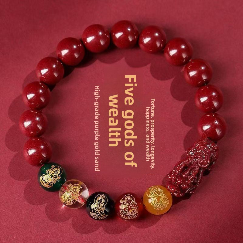 Cinnabar Five-Way Wealth God beaded bracelet shown on plain background