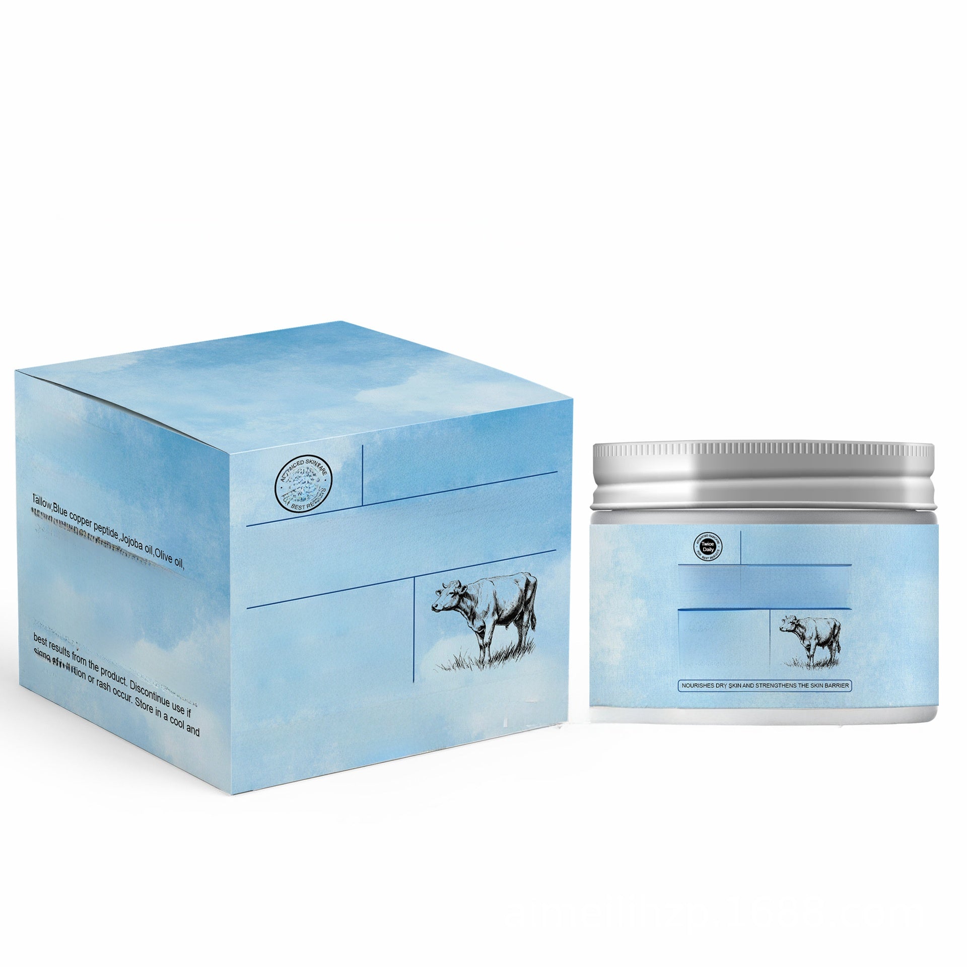 Pale blue whipped tallow balm jar beside its cloud print box with a small cow illustration on a white backdrop