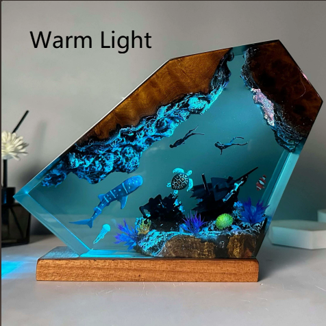Resin ocean night light in warm light setting with divers and whale shark