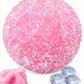 Pink and green textured squeeze balls set side by side to compare their colors