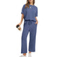 Short-sleeve top and matching bottoms laid out flat, top down view