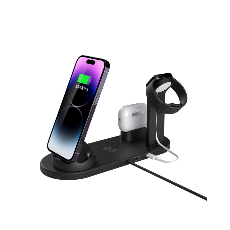 Black four in one charging stand holding a phone, a smartwatch and wireless earbuds