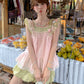 Side view of the sleeveless floral top showing open armhole and Peach Pink print