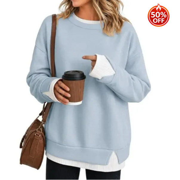 Light blue women's sweatshirt showing the split hem and contrast white rib detail