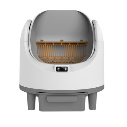 Automatic cat litter box placed in a home corner ready for use