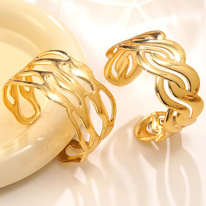 Two plain gold pierced cuffs with open gaps through the band, a style not sold among the five colours