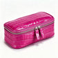 Magenta crocodile pattern genuine leather cosmetic bag with silver double zipper, three quarter view