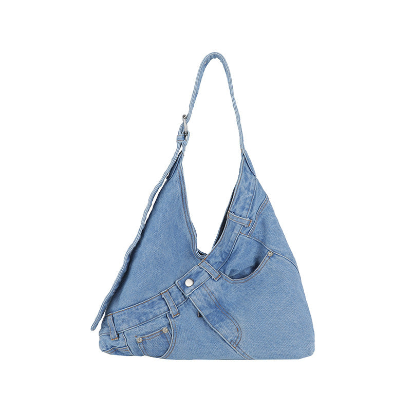 Dark blue denim shoulder bag with a top zip and rivet detailing