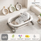 Baby bathtub with printed floating mat and three washbasins hung on the bathroom wall