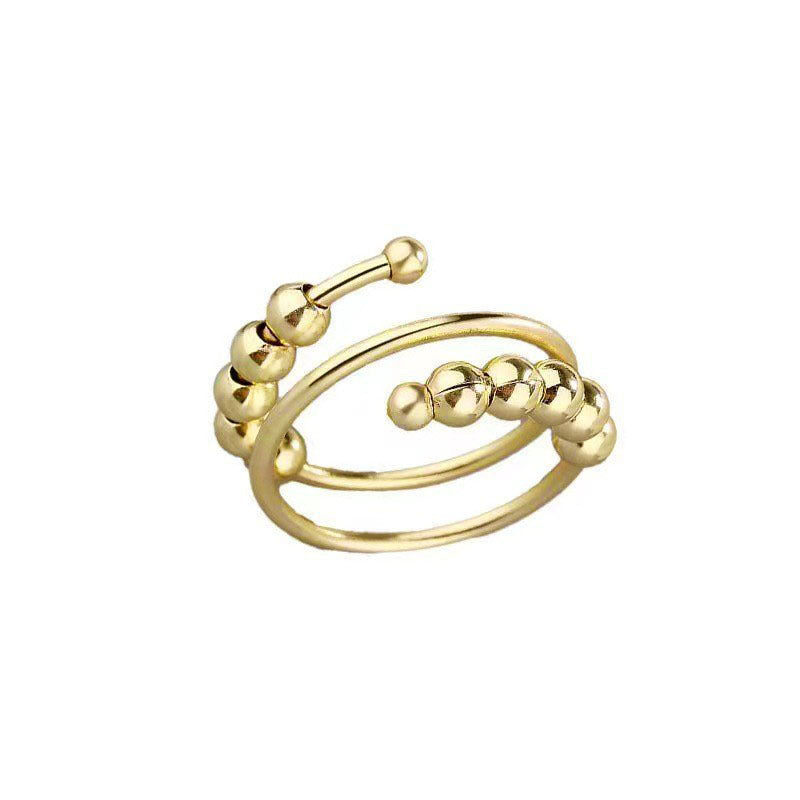 Silver tone double coil spinner ring with round beads set at both ends of the wrapped band