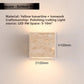 Travertine LED sconce shown with mounting bracket and screws for wall fitting
