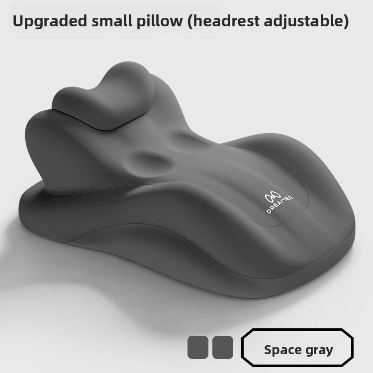 Space gray molded foam lounge pillow with a buttoned adjustable headrest