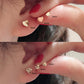 Mini heart gold stud earring side profile showing the post and heart shape close up