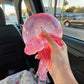 Pink glitter NeeDoh Jelly Squish jellyfish squeezed to show its soft ribbon tentacles
