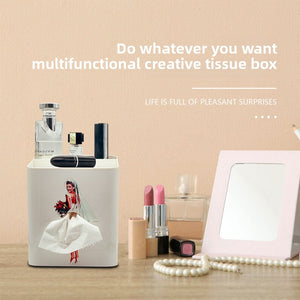 White bride and groom tissue box on a dresser, top tray holding lipsticks and a perfume bottle