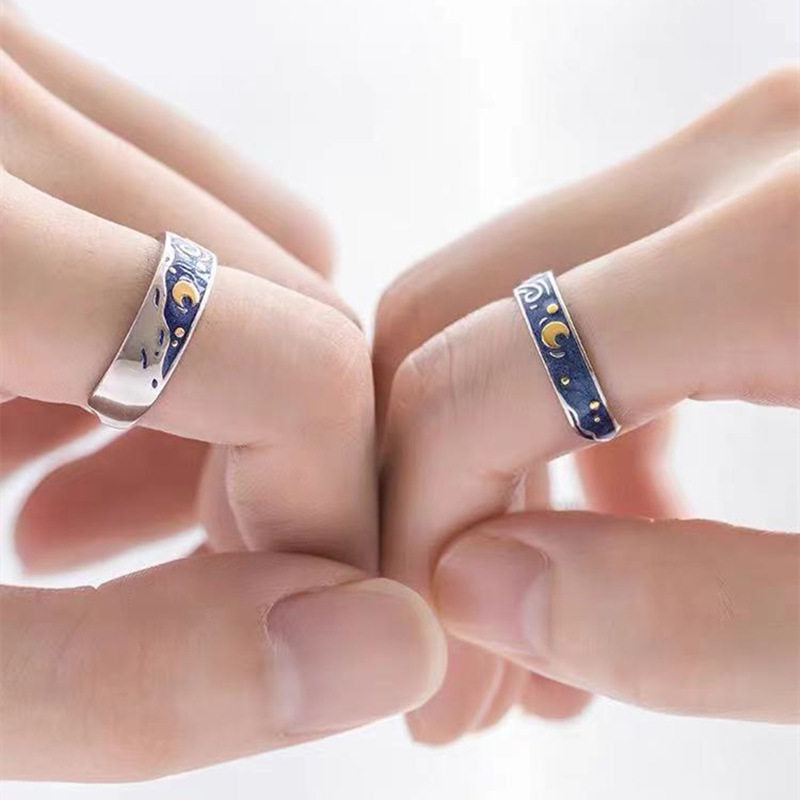 Starry Night ring styled on a finger with the blue and gold panel facing up