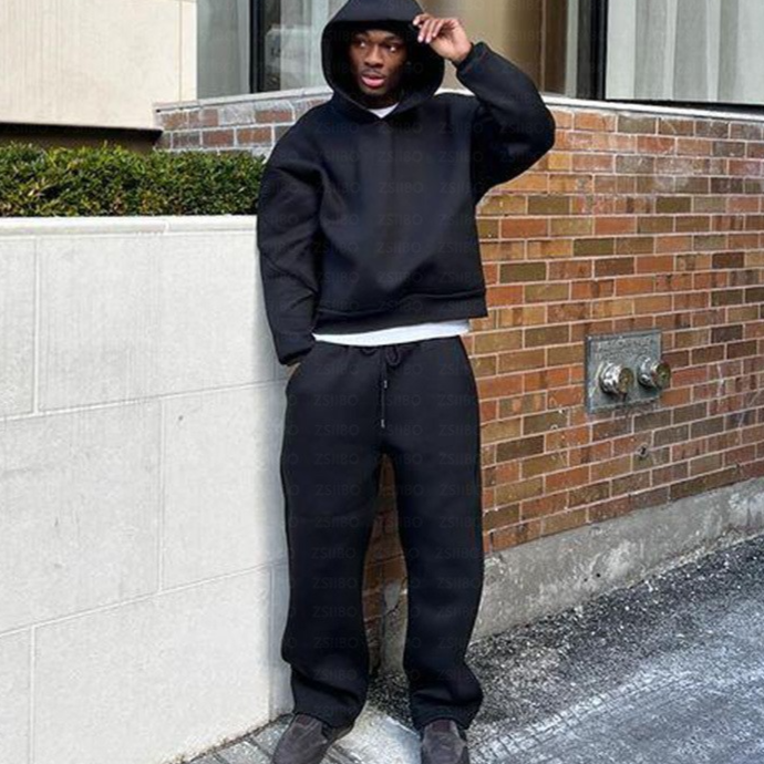 Boxy cropped grey white hoodie with dropped shoulder and ribbed cuffs from the front