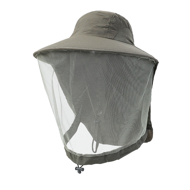Wide brim nylon sun hat with the net gathered up, worn as a normal hat