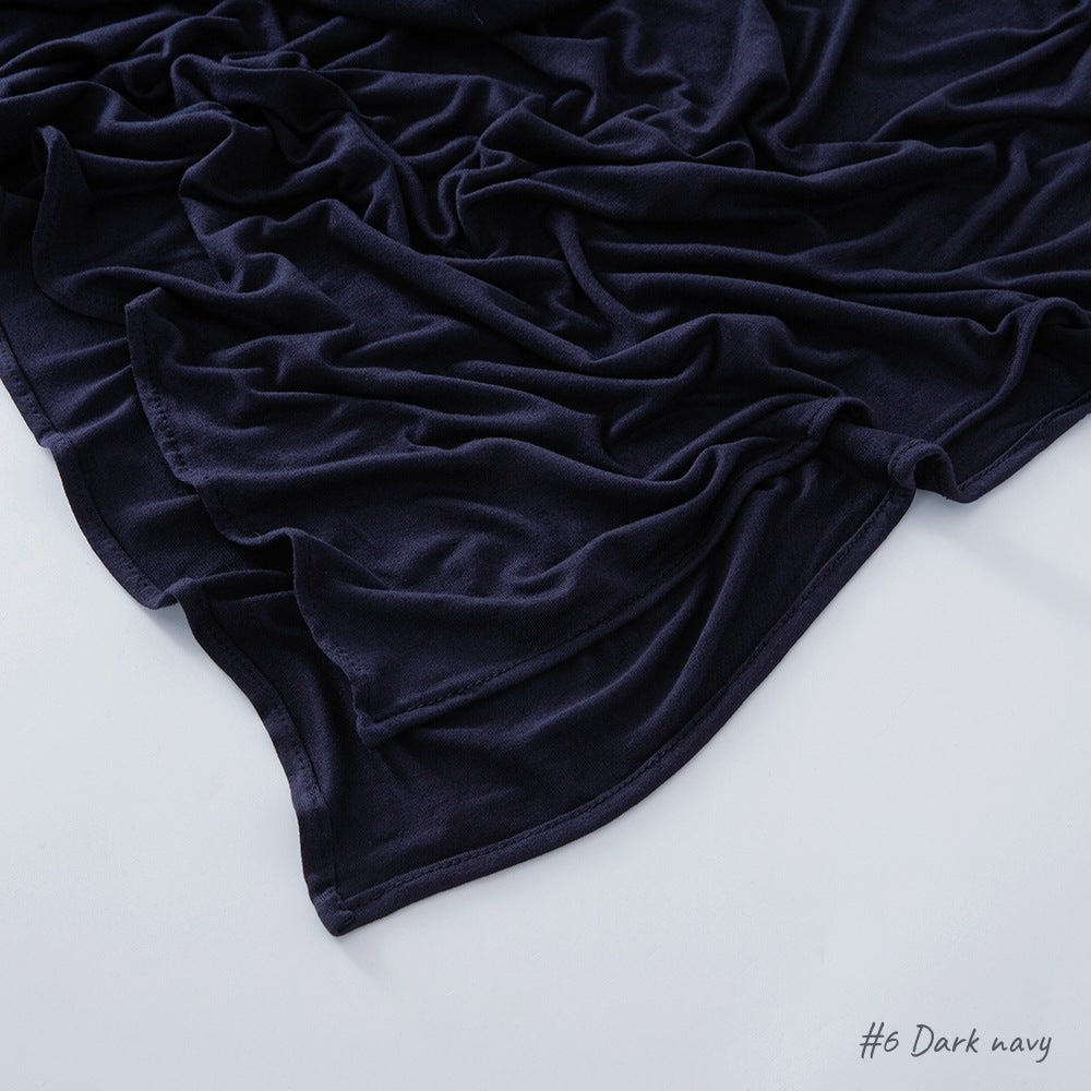 Modal cotton headscarf wrap with a narrow rolled hem running along the finished rectangular edge