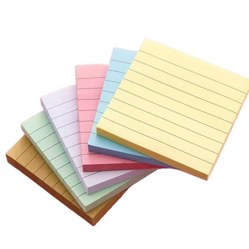 Green lined sticky note pad showing the horizontal ruling printed across each sheet