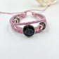 Braided cord charm bracelet shown from above with the sliding knot at the back