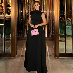 White sleeveless long dress shown from the front