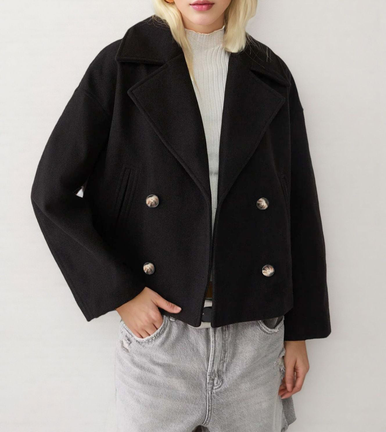 Army green short double breasted wool coat with wide notch lapels worn open