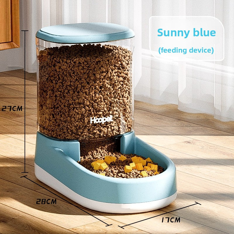 Gravity pet feeder tank lifted off the base for rinsing and refilling