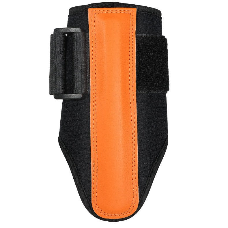 Front view of the orange and black golf wrist support with a slide buckle and hook and loop strap