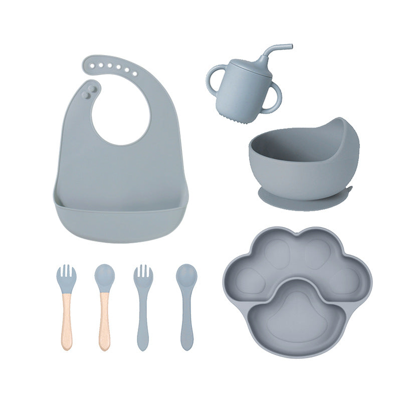 Dark blue gray 8-piece baby feeding set with a bib, a sippy cup, a bowl, four utensils and a bear paw plate