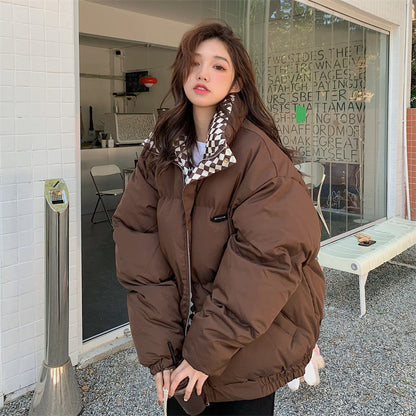 Womens padded puffer coat in coffee brown with a stand collar and full zip, worn on a model