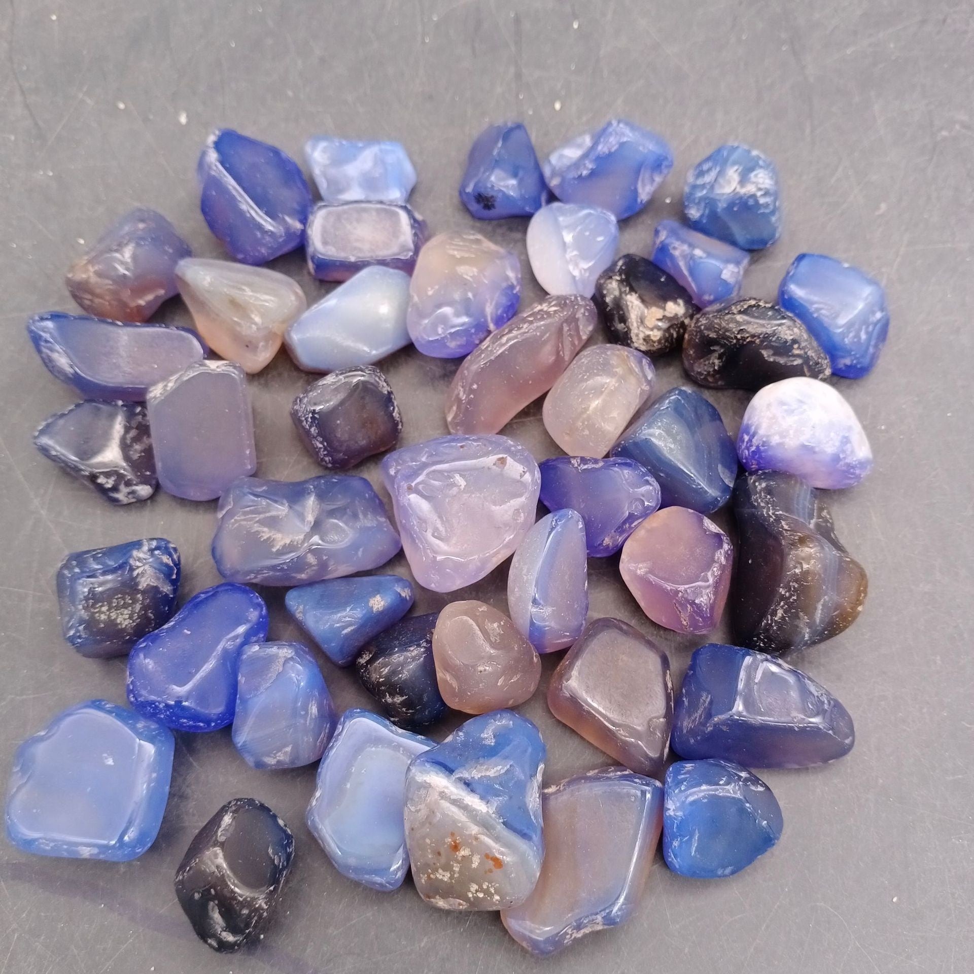 Larger tumbled agate stones in mixed colours for landscaping accents